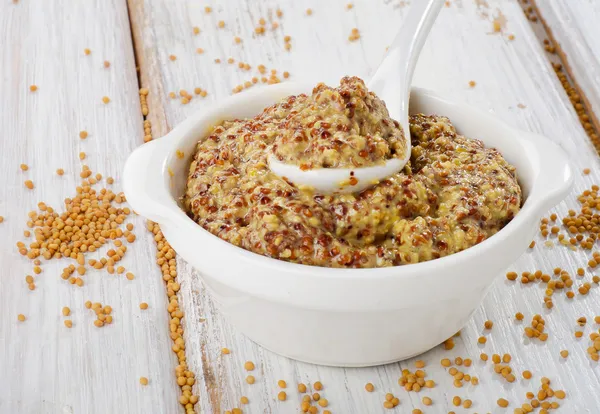 Mustard sauce on wooden table — Stock Photo, Image