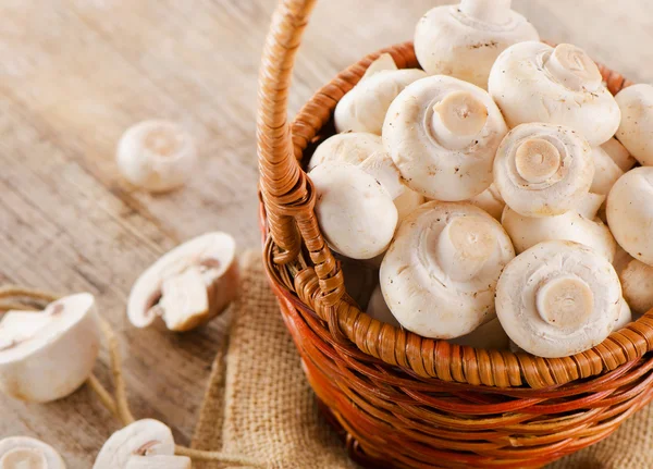 Mushrooms on a wooden table — Stock Image Mushrooms on a wooden table Stock Photo
