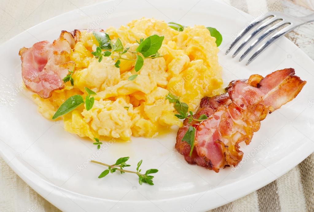 Scrambled eggs and bacon Stock Photo by ©bit245 49050309