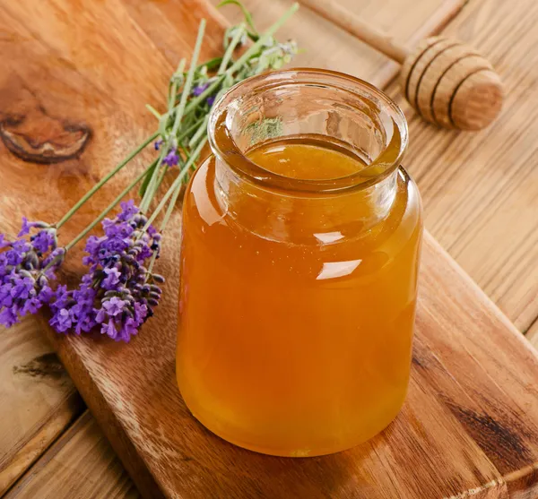 Glass jar of honey — Stock Photo, Image