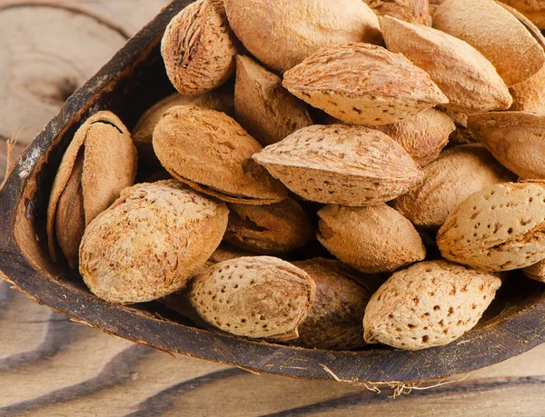 Almonds  on wooden table — Stock Photo, Image