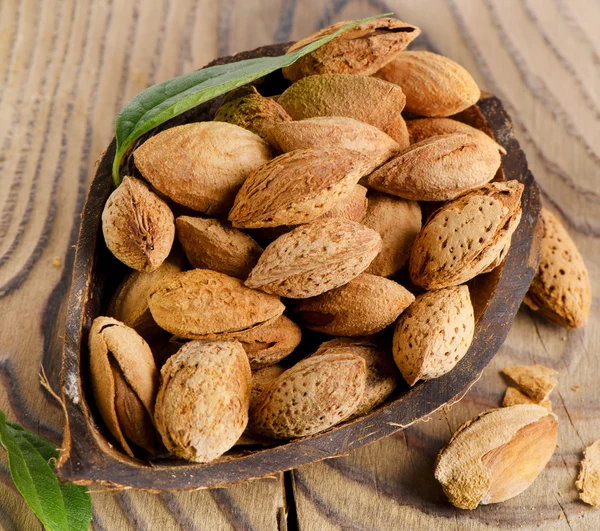 Almonds  on wooden table — Stock Photo, Image