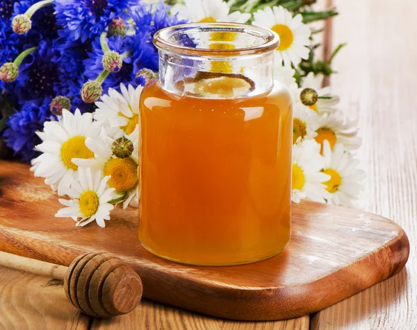 Honey Jar with wooden stick — Stock Photo, Image