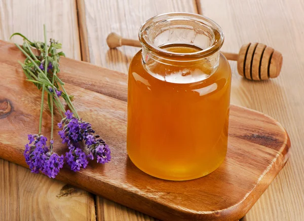 Glass jar of honey — Stock Photo, Image