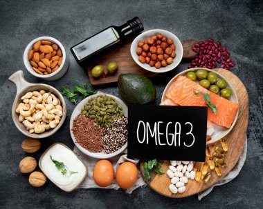 Assortment of omega 3 best sources on dark background. Healthy diet concept. Top view, flat lay clipart