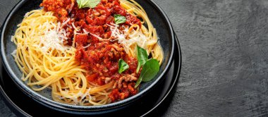 Spaghetti Bolognese on gray background. Traditional Italian pasta. Homemade food concept. copy space