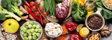 Plant based diet on gray background. Healthy food concept. Top view, flat lay, panorama