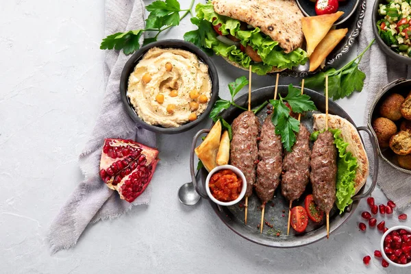 Lebanese food assortment on light background. Traditional food concept. Top view, flat lay, copy space