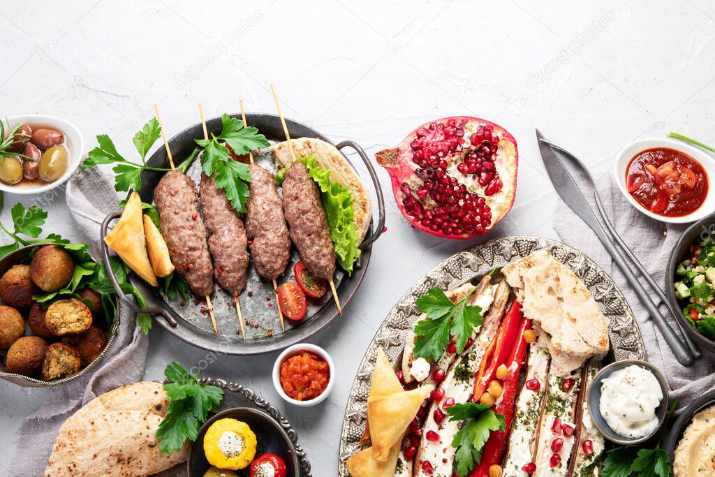 Lebanese food assortment on light background. Traditional food concept. Top view, flat lay, copy space