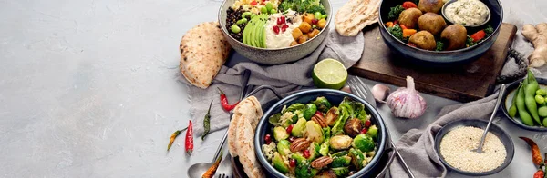 Vegan dishes assortment on light background. Mediterranean diet concept. copy space, panorama