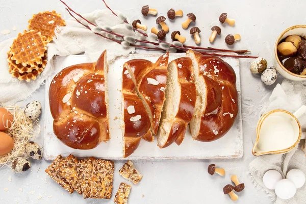 Easter sweet bread, tsoureki cozonac sliced. Easter time, springtime. Holiday food concept. Top view, flat lay,