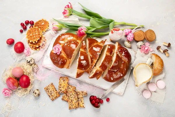 Easter sweet bread, tsoureki cozonac sliced. Easter time, springtime. Holiday food concept. Top view, flat lay