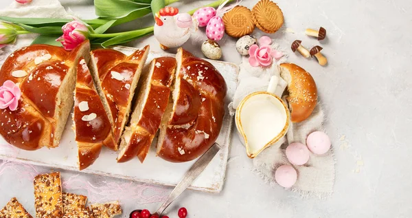 Easter sweet bread, tsoureki cozonac sliced. Easter time, springtime. Holiday food concept. Top view, flat lay, copy space