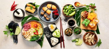 Japanese food assortment on light background. Traditional food concept. Dishes and appetizers of indeed cuisine. Top view, flat lay, panorama