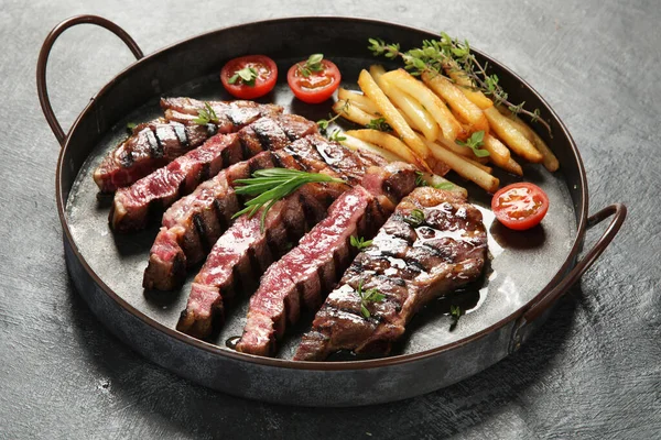 Sliced Beef Steak French Fries Tomatoes Dark Plate Grey Background — Foto de Stock