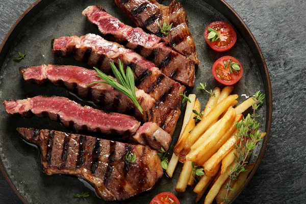 Beef Steak Meat Tomato French Potatoes Dark Plate Grey Background — Stock Fotó