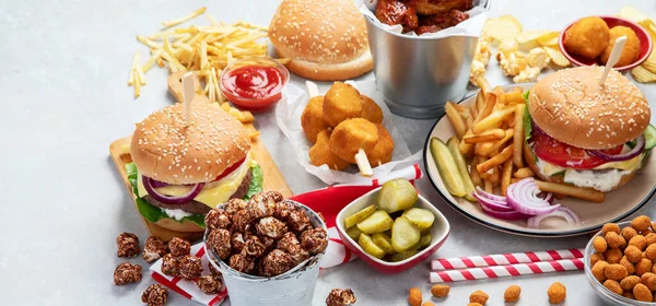 Various American Food French Fries Hamburgers Nuggets Hotdog Chips Popcorn — 图库照片