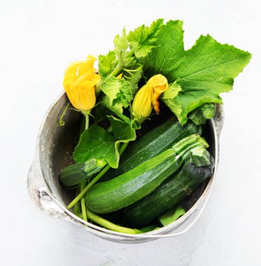 Composition with zucchini on neutral background. Popular component of healthy diets. Top view
