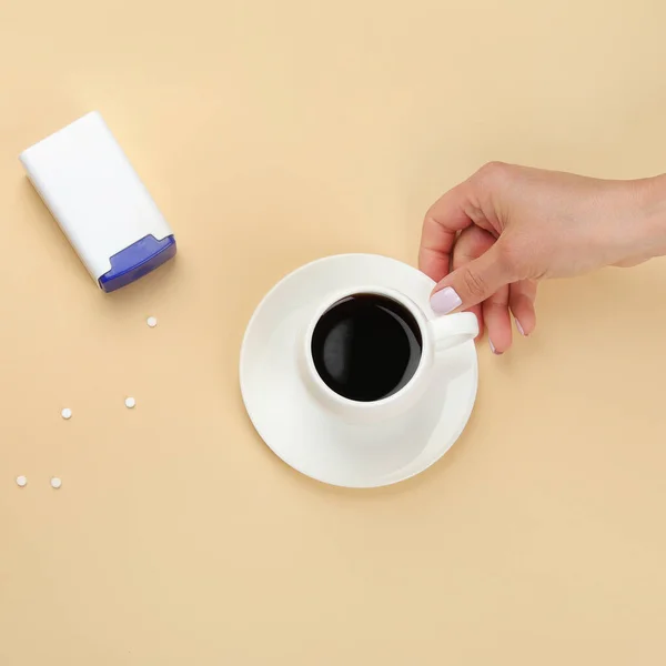 Close Woman Hand Throwing Saccharin Pills Coffee Cup White Background — Fotografia de Stock