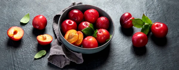 Red Plums Isolated Dark Background Top View Panorama — Stockfoto