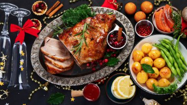 Traditional Christmas dinner on dark background. Holiday food. Top view