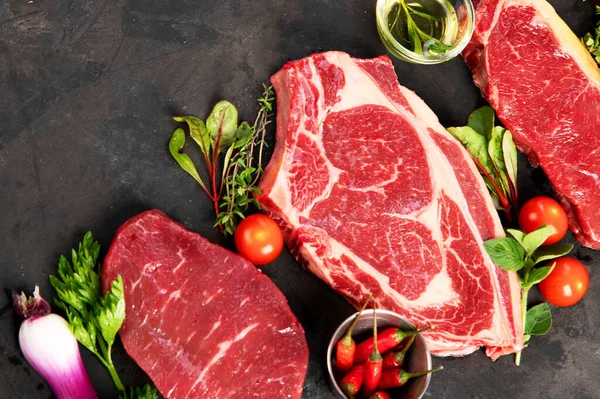 Variety Raw Beef Meat Steaks Grilling Seasoning Utensils Dark Background — 스톡 사진