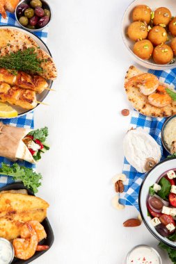 Greek cuisine dishes on neutral background. Traditional food concept. Top view, copy space