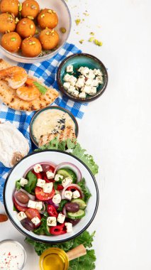 Greek cuisine dishes on neutral background. Traditional food concept. Top view, copy space