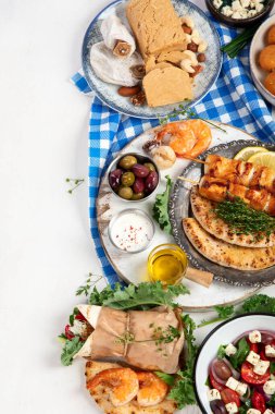 Greek cuisine dishes on neutral background. Traditional food concept. Top view, copy space