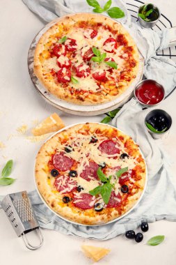 Freshly baked pizza on dark background. Tasty homemade food concept. Top view, copy space