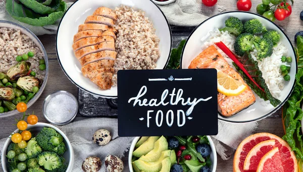 Table of various healthy food  dishes. Healthy food assortment. Dieting concept. Flat lay, top view.