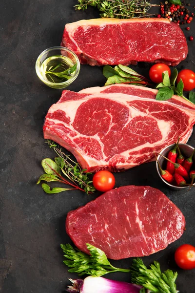 Variety Raw Beef Meat Steaks Grilling Seasoning Utensils Dark Background — Fotografia de Stock
