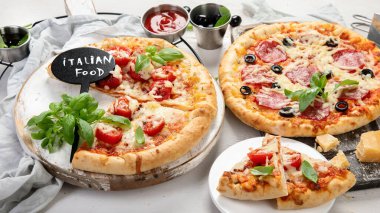 Freshly baked pizza on dark background. Tasty homemade food concept. 