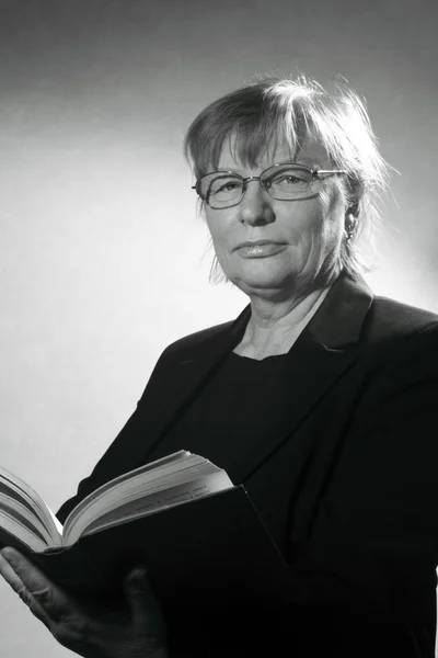 Woman in eyeglasses with book — Stock Photo, Image