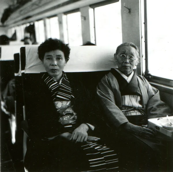 Two women in kimono in a train — Stock Photo, Image