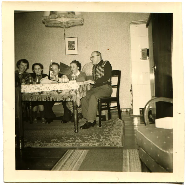 Group of people sitting at a dining table — Stock Photo, Image