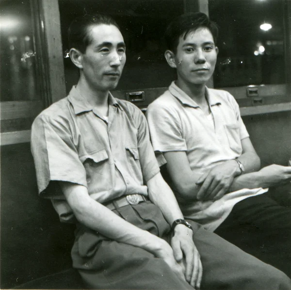 Two men seating near window — Stock Photo, Image