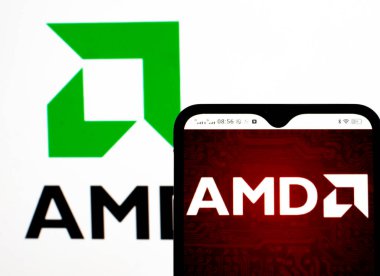Kiev, Ukraine, October 21, 2021. In this photo illustration Advanced Micro Devices, Inc. logo seen displayed on a smartphone clipart