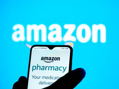Kiev, Ukraine - January 7, 2022: In this photo illustration Amazon Pharmacy logo seen displayed on a smartphone