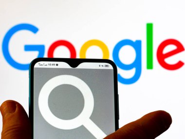 Kiev, Ukraine - January 8, 2022: In this photo illustration Google Search (grey) logo seen displayed on a smartphone