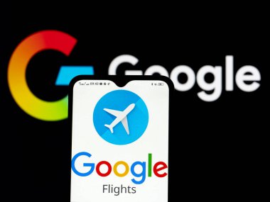  Kiev, Ukraine - January 9, 2022: In this photo illustration Google Flights logo seen displayed on a smartphone