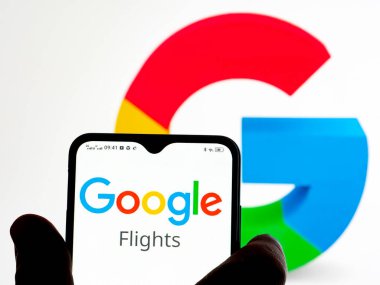  Kiev, Ukraine - January 9, 2022: In this photo illustration Google Flights logo seen displayed on a smartphone