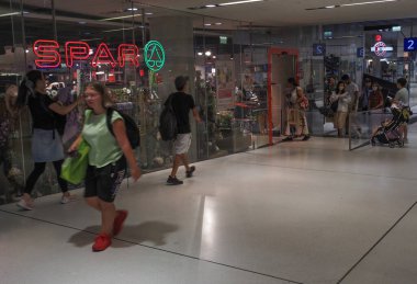 Salzburg, Ausatria - August 5, 2022: People head to the Spar supermarket in Forum 1 mall