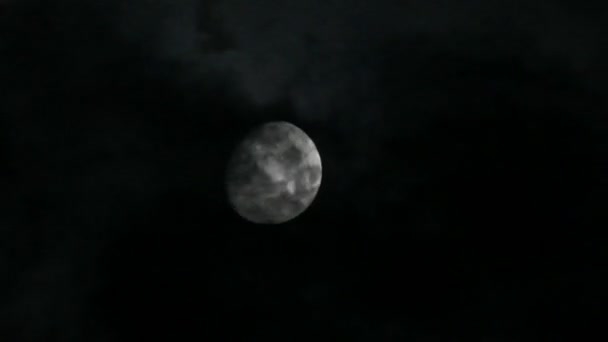 Timelapse with moon moving between clouds — Stock Video