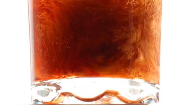 Cola is poured into a glass close-up - slow motion — Stock Video