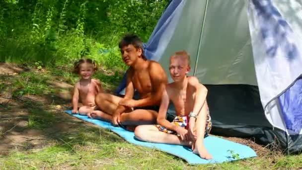 Camping children near tent in forest — Stock Video