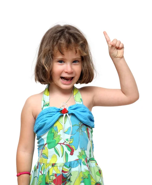 Cute little girl pointing with finger up — Stock Photo, Image