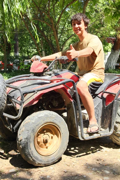 Happy asian boy on quad bike atv — Stock Photo, Image