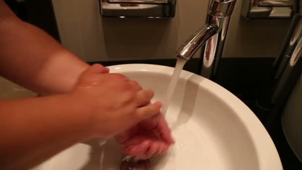 Man washes his hands under tap — Stock Video