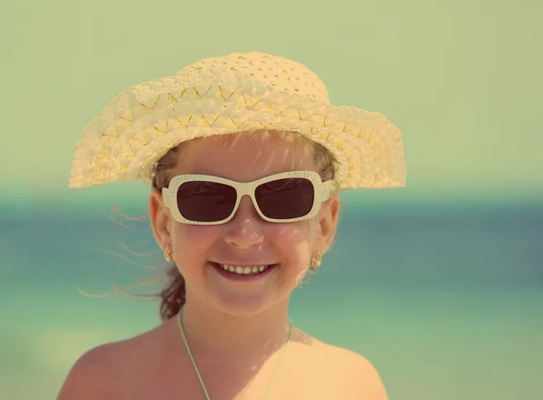 Little girl in sunglasses and hat - vintage retro style — Stock Photo, Image